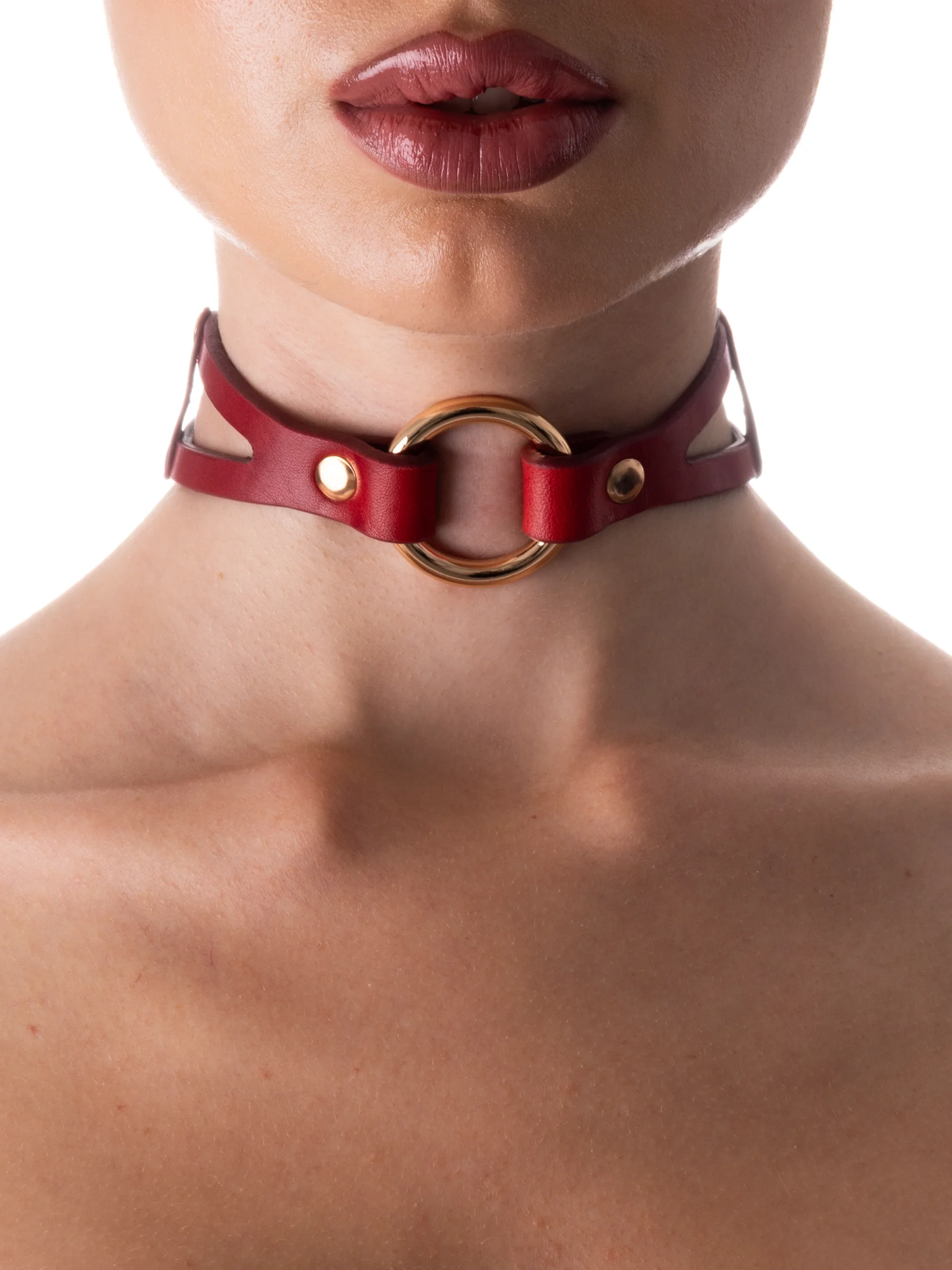 Woman wearing a beautiful red gothic choker with gold metal
