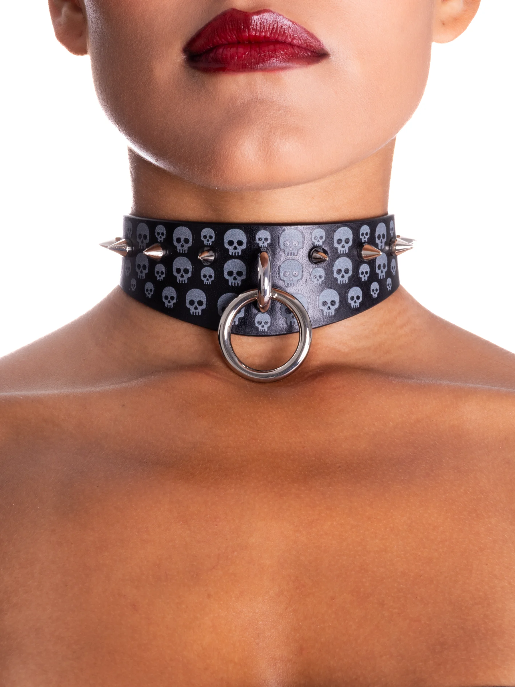 A black gothic collar with spikes and skulls printed on the sides